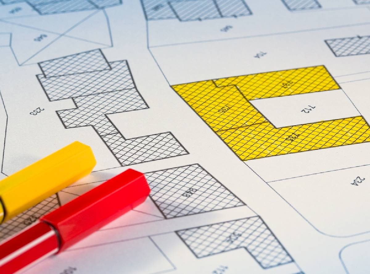 close of of red and yellow felt tip pens on a plan